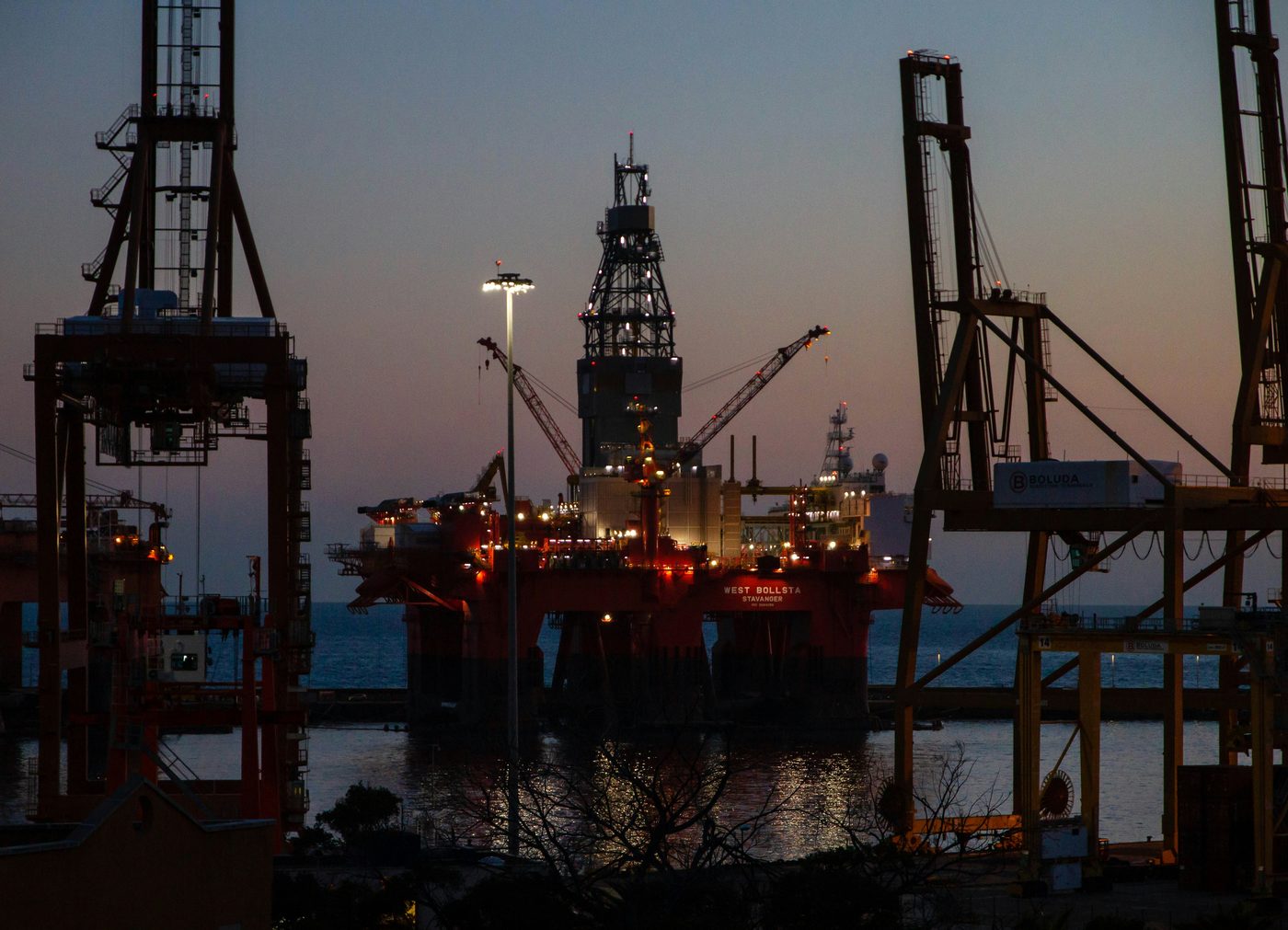 Offshore drilling rig at dusk